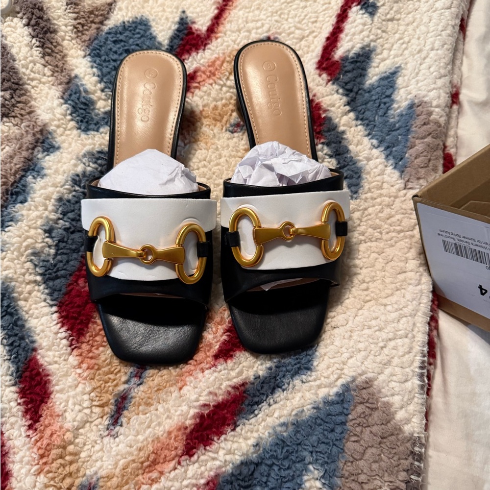 Elegant Black and White Mules with Gold Detail